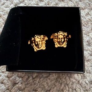 Versace “Medusa” stud earrings.